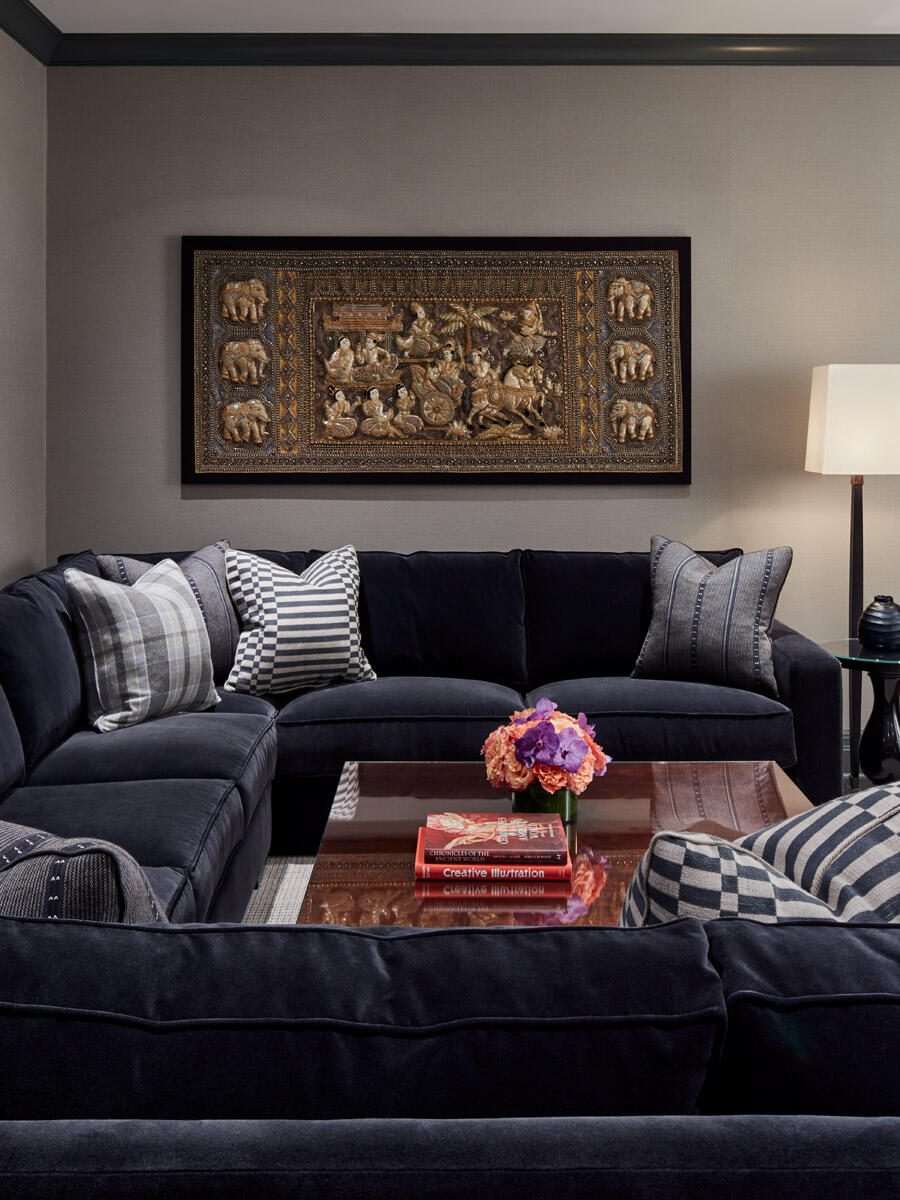 Navy Sectional Sofa and Cultural Wall Art