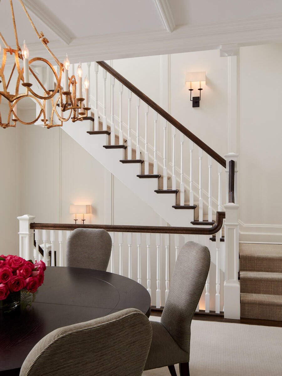 Angular Staircase Behind a Simple Dining Area