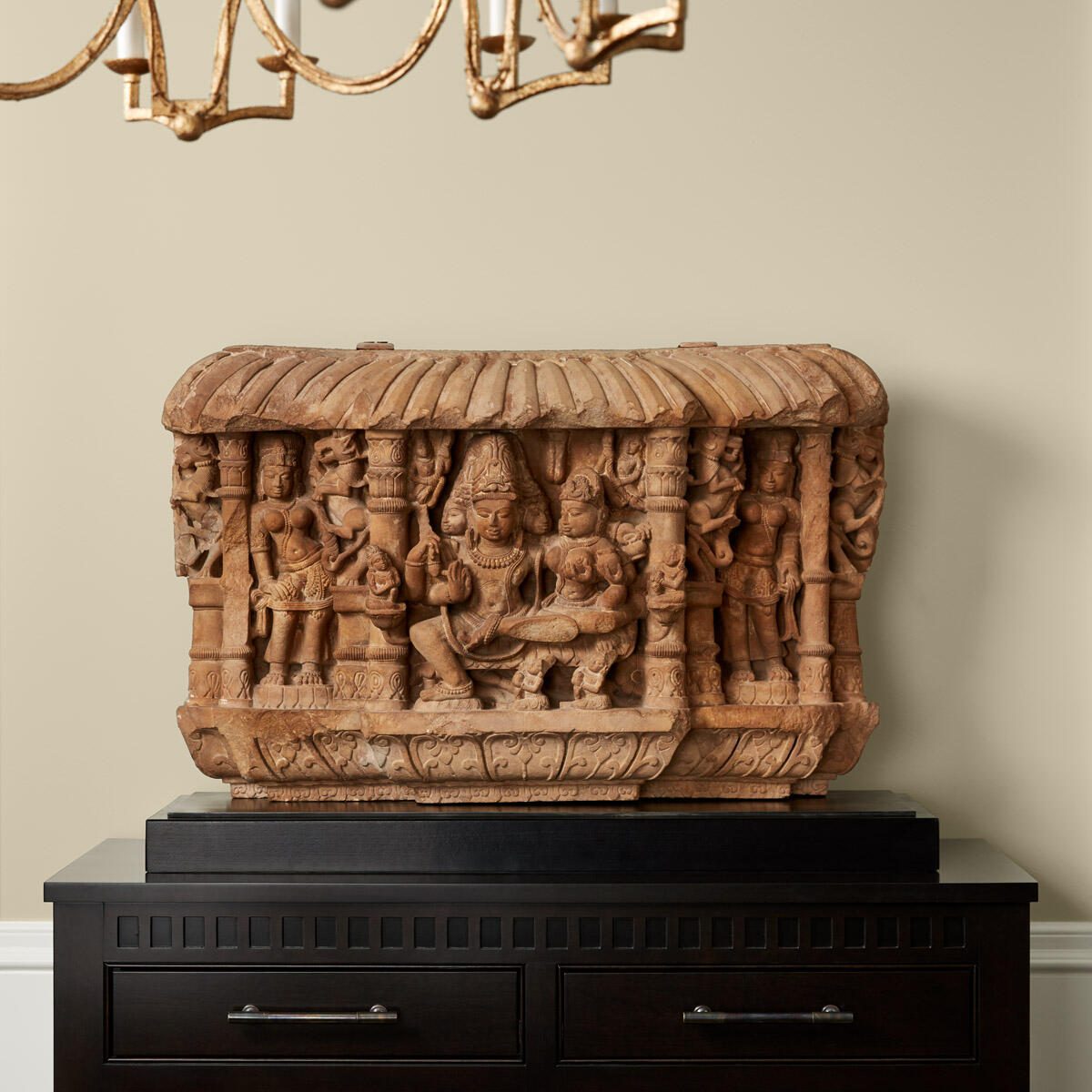 Indian Sculpture placed on Top of a Black Credenza